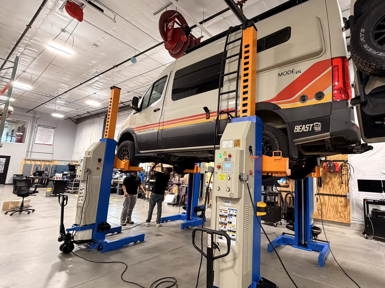Sprinter van on column lifts in the Voltagen service bay